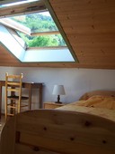 Gite isère Au Vieux Four à Pain La grande chambre Belledonne. Vue sur la forêt et la montagne, chambre Belledonne.